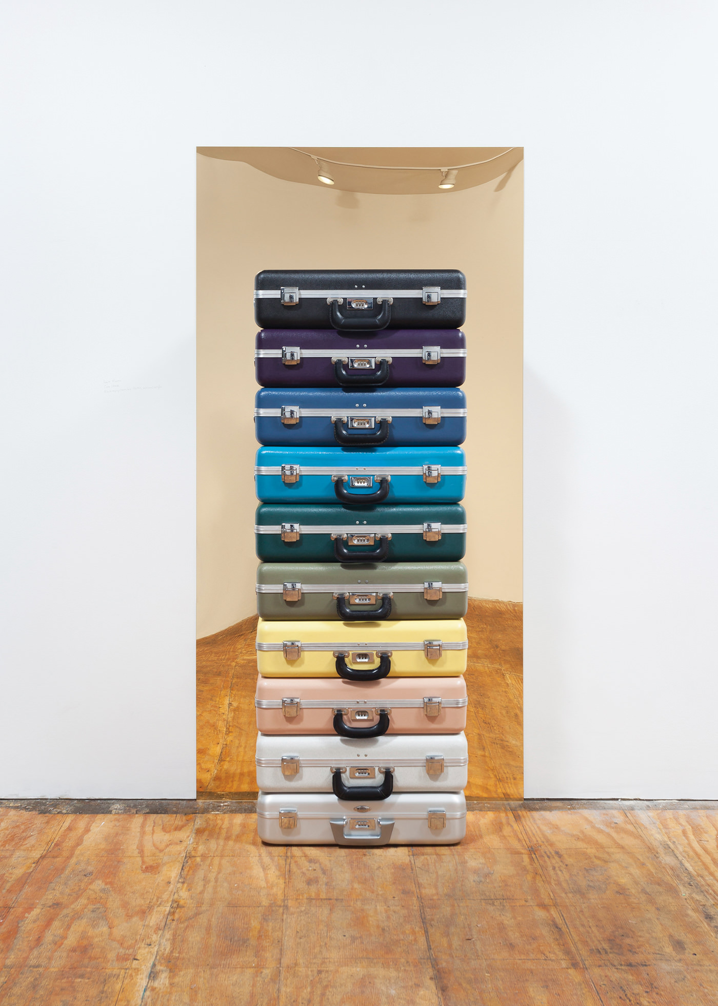Regina Mamou  Untitled (Case Stack), 2015 Installation at Slow Gallery, Chicago  Electropsychometer cases, mirrored acrylic  Electropsychometer cases: 6 x 24 x 16 inches (each); Acrylic element: 72 x 36 inches